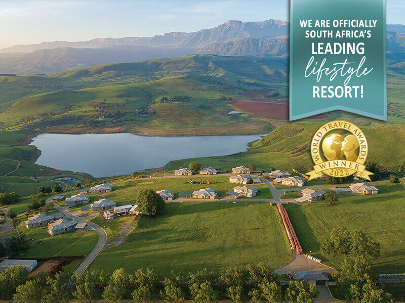 An ariel view of the Cayley Mountain Resort with a badge and label overlayed, highligting the recently received World Travel Award for being South Africa's leading lifestyle resort